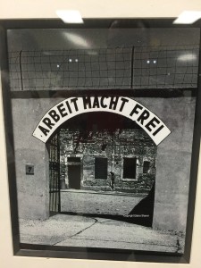 Entrance to Terezine with a sign above that reads, "Work makes you free."